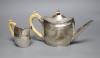 A George III silver teapot, with ivory handle, Henry Green, London, 1795 and a similar cream jug, London, 1796, (a.f.)                                                                                                      