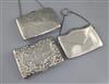 Two late Victorian/Edwardian silver mounted card purses, both with aide memoir and a George V silver "envelope" card case,             