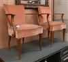 A pair of French Art Deco beech elbow chairs                                                                                           