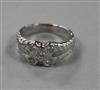 An 18ct white gold and collet set five stone diamond dress ring, size L.                                                               