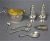 A silver cream jug, two silver pepperettes, three silver condiment spoons and two caddy spoons.                                        