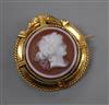 A 19th century French 18ct yellow metal mounted sardonyx cameo pendant brooch, carved with the bust of a lady to sinister, 35mm.       