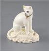 A rare Rockingham porcelain figure of a seated cat, c.1830, H. 6.1cm                                                                   