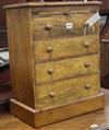 A miniature walnut chest W.42cm.                                                                                                       