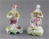 A near pair of early Derby 'Pale Family' figures of a seated gentleman and woman, c. 1756-8, h. 13cm, slight restoration               