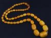 A single strand graduated amber bead necklace, 70cm.                                                                                   