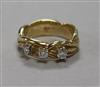 A 14ct gold and claw set three stone diamond dress ring, size O.                                                                       