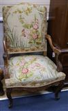 A pair of Louis XV style walnut open armchairs                                                                                         