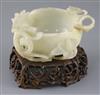 A Chinese pale celadon jade 'lotus' cup, late Ming dynasty, W.13cm, associated wood stand                                              