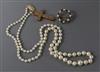 A cultured pearl necklace, a 9ct gold cross and a mounted brooch                                                                       