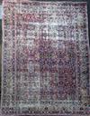 A Kirman ivory ground carpet,                                                                                                          