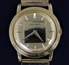 A gentleman's 18ct gold Movado manual wind wrist watch, on an associated 9ct gold brick link bracelet,                                 