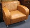 A tan leather armchair                                                                                                                 