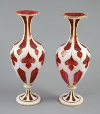 A pair of Bohemian white and ruby overlaid glass vases, 31cm high                                                                      