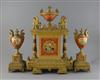 A 19th century French ormolu and porcelain classical revival clock garniture, clock H.17in. urns 11.25in.                              