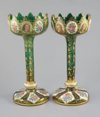 A pair of Bohemian enamelled white overlaid green glass vases, late 19th century, 31cm high                                            