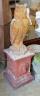 A reconstituted stone owl garden ornament on terracotta plinth, total height 130cm                                                                                                                                          