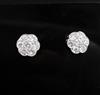 A pair of platinum and diamond seven-stone cluster ear studs, 12mm.                                                                    