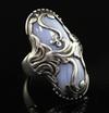 A stylish Georg Jensen sterling silver and banded blue agate oval upfinger ring, no. 18, size L.                                       