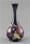 A Moorcroft 'pansy' bottle vase, c.1917, H.21.7cm, professionally restored                                                             