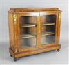 A Victorian marquetry inlaid burr walnut bookcase, W.4ft D.1ft 3in. H.3ft 7.5in.                                                       