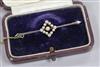 An Edwardian 15ct gold, diamond and seed pearl cluster set bar brooch, 48mm.                                                           