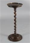 A 17th century fruitwood candle stand on spiral-turned column, H.2ft 3in. Diam. 11in. (some restoration)                               