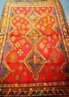 A Shiraz red ground rug 236 x 165cm                                                                                                    