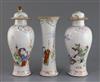 A garniture of three Chinese famille rose 'eighteen luohan' vases, Qianlong period, 14.3cm - 18.5cm, some damage                       