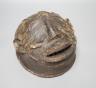 A terracotta Makonde helmet mask (Tanzanian) 21cm diameter                                                                                                                                                                  