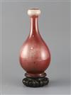 A Chinese sang de boeuf lang yao garlic neck vase, 19th century, H.24cm, two small foot chips, wood stand                              