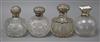 Four silver mounted spherical glass scent bottles, largest 12cm.                                                                       