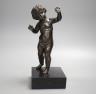 A 20th century bronze putto on wooden stand 29cm including stand                                                                                                                                                            