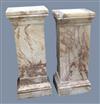 A near pair of square section pink veined marble pedestals, W.1ft 6in. D.1ft 4in. H.3ft 8in.                                           