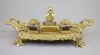 A Victorian ormolu ink stand, width 17.5in. depth 9in. height 6in.                                                                     