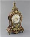 An early 20th century ormolu and red boulle Louis XVI style mantel clock, 19in.                                                        