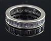 A white gold and baguette cut diamond set full eternity ring, size L.                                                                  