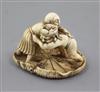 A Japanese ivory netsuke of two wrestlers, Meiji period, w. 4.2cm                                                                      