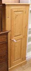 A slender pine cupboard W.66cm                                                                                                         