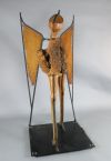 Maureen Langley (1931-) South African. wood, leather and wrought iron; 'Locust - the Arrogance of Man' H. 6ft., W.35in.                