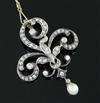 A late Victorian gold and silver, diamond and drop pearl set openwork scroll pendant brooch, gross weight 8.9 grams.                   