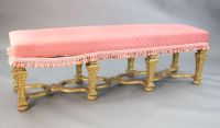 A Louis XIV style carved giltwood stool, W.5ft 4in. D.1ft 6in. H.1ft 8in.                                                              