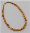 A single strand amber bead necklace, gross 21 grams, 44cm.                                                                             