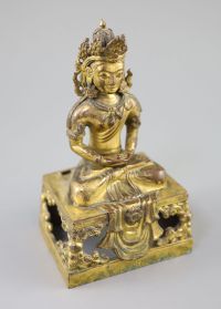 A Chinese gilt bronze seated figure of Amitayus, Qianlong period, dated 1770, Provenance - A. T. Arber-Cooke                           