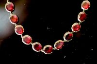 An early 19th century gold and garnet set necklace,                                                                                    