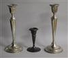 A pair of George V silver candlesticks, William Hutton & Sons, Birmingham, 1914/5 and one other smaller silver candlestick.            