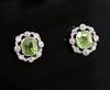 A pair of mid 20th century white gold, peridot and diamond cluster set earstuds, gross 3.1 grams.                                      