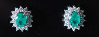 A modern pair of white gold?, emerald and diamond cluster oval earrings,                                                               