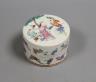 A 19th century Chinese famille rose box and cover, Liberty retail label, 9.5 cms diameter.                                                                                                                                  