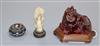 A Japanese ivory cane handle, a faux amber lion-dog and an enamel and ivory pill box                                                   